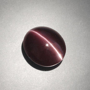 Натуральный коричневый cat's eye scapolite 4,00 карата огранка овал, непрозрачный