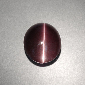 Натуральный коричневый cat's eye scapolite 4,00 карата огранка овал, непрозрачный