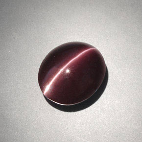 Натуральный коричневый cat's eye scapolite 4,00 карата огранка овал, непрозрачный