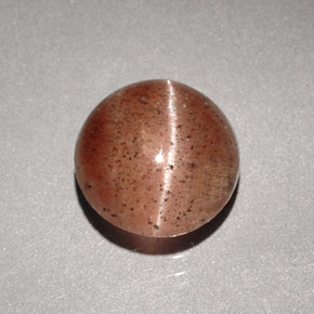 Натуральный коричневый cat's eye scapolite 1,96 карата прозрачный, полупрозрачный