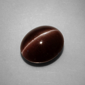 Натуральный коричневый cat's eye scapolite 3,52 карата огранка овал, непрозрачный