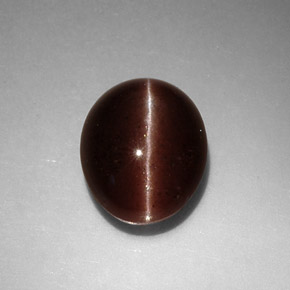 Натуральный коричневый cat's eye scapolite 3,52 карата огранка овал, непрозрачный