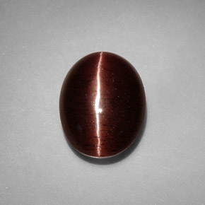 Натуральный коричневый cat's eye scapolite 3,41 карата огранка овал, непрозрачный