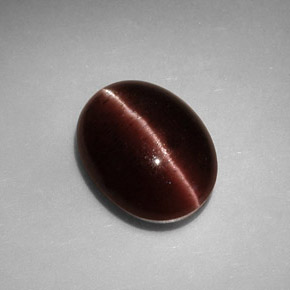 Натуральный коричневый cat's eye scapolite 3,41 карата огранка овал, непрозрачный