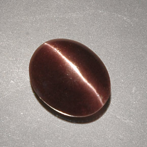 Натуральный коричневый cat's eye scapolite 2,32 карата огранка овал, непрозрачный
