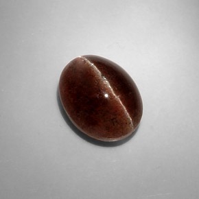 Натуральный коричневый cat's eye scapolite 8,31 карата огранка овал, полупрозрачный