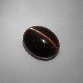 Натуральный коричневый cat's eye scapolite 6,90 карата огранка овал, полупрозрачный