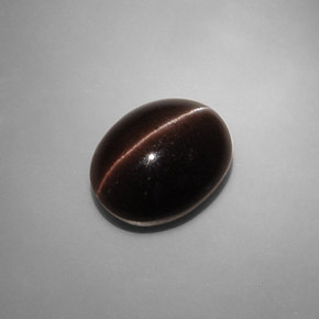 Натуральный коричневый cat's eye scapolite 6,90 карата огранка овал, полупрозрачный