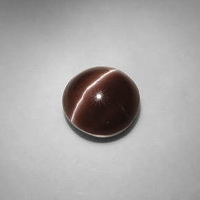 Натуральный коричневый cat's eye scapolite 5,82 карата огранка круг, полупрозрачный