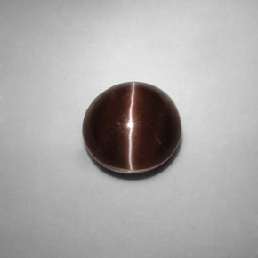 Натуральный коричневый cat's eye scapolite 5,82 карата огранка круг, полупрозрачный