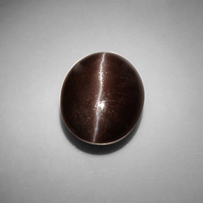 Натуральный коричневый cat's eye scapolite 8,66 карата огранка овал, полупрозрачный
