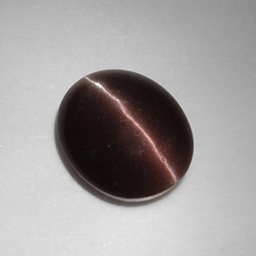 Натуральный коричневый cat's eye scapolite 5,88 карата огранка овал, полупрозрачный