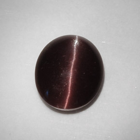 Натуральный коричневый cat's eye scapolite 5,88 карата огранка овал, полупрозрачный