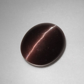 Натуральный коричневый cat's eye scapolite 5,88 карата огранка овал, полупрозрачный