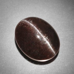 Натуральный коричневый cat's eye scapolite 9,31 карата огранка овал, полупрозрачный