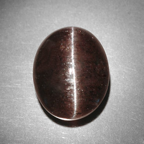 Натуральный коричневый cat's eye scapolite 9,31 карата огранка овал, полупрозрачный