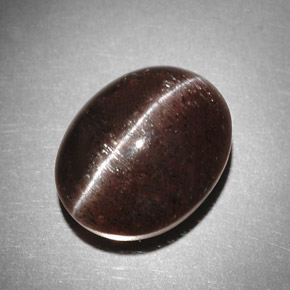 Натуральный коричневый cat's eye scapolite 9,31 карата огранка овал, полупрозрачный