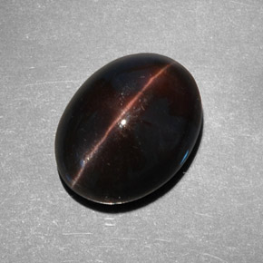 Натуральный коричневый cat's eye scapolite 9,21 карата огранка овал, полупрозрачный