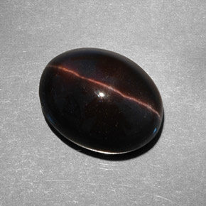 Натуральный коричневый cat's eye scapolite 9,21 карата огранка овал, полупрозрачный