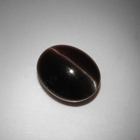 Натуральный коричневый cat's eye scapolite 11,50 карата огранка овал, полупрозрачный