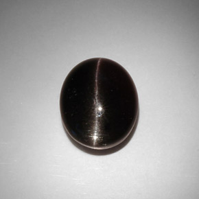 Натуральный коричневый cat's eye scapolite 11,50 карата огранка овал, полупрозрачный