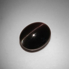 Натуральный коричневый cat's eye scapolite 11,50 карата огранка овал, полупрозрачный