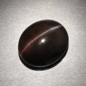 Натуральный коричневый cat's eye scapolite 6,82 карата огранка овал, полупрозрачный