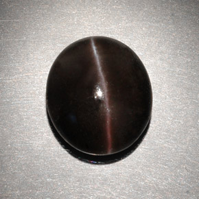 Натуральный коричневый cat's eye scapolite 6,82 карата огранка овал, полупрозрачный