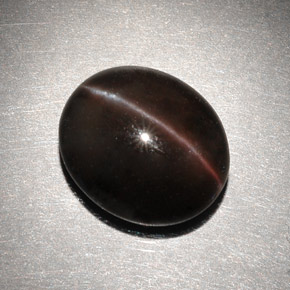 Натуральный коричневый cat's eye scapolite 6,82 карата огранка овал, полупрозрачный