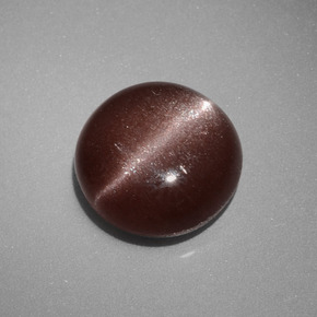 Натуральный коричневый cat's eye scapolite 2,40 карата огранка круг, непрозрачный