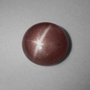 Натуральный коричневый cat's eye scapolite 1,54 карата огранка круг, непрозрачный