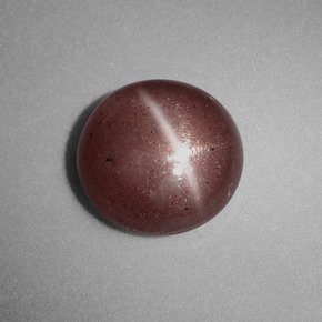 Натуральный коричневый cat's eye scapolite 1,54 карата огранка круг, непрозрачный