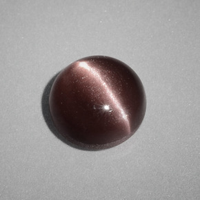 Натуральный коричневый cat's eye scapolite 1,58 карата огранка круг, непрозрачный