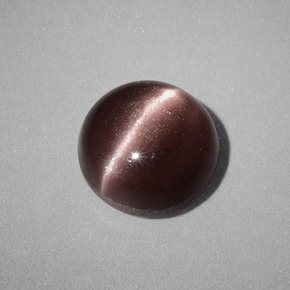 Натуральный коричневый cat's eye scapolite 1,58 карата огранка круг, непрозрачный