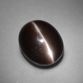 Натуральный коричневый cat's eye scapolite 4,41 карата огранка овал, непрозрачный