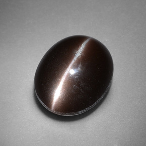 Натуральный коричневый cat's eye scapolite 4,41 карата огранка овал, непрозрачный