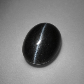 Натуральный чёрный cat's eye scapolite 3,37 карата огранка овал, непрозрачный