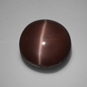 Натуральный коричневый cat's eye scapolite 10,97 карата огранка круг, непрозрачный