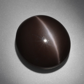 Натуральный коричневый cat's eye scapolite 24,01 карата огранка овал, непрозрачный