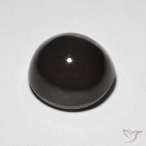 Натуральный коричневый cat's eye scapolite 3,32 карата огранка овал, полупрозрачный