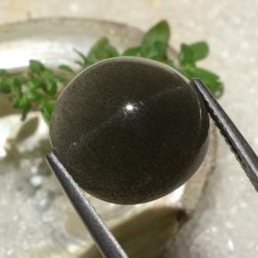 Натуральный коричневый cat's eye scapolite 6,50 карата огранка круг, полупрозрачный