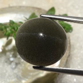 Натуральный коричневый cat's eye scapolite 6,50 карата огранка круг, полупрозрачный