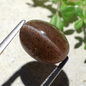 Натуральный коричневый cat's eye scapolite 4,55 карата огранка овал, полупрозрачный