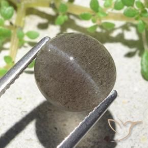 Натуральный коричневый cat's eye scapolite 3,94 карата огранка овал, полупрозрачный