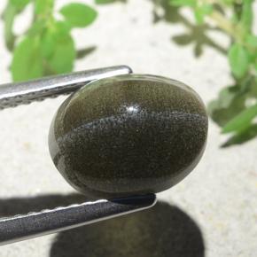Натуральный коричневый cat's eye scapolite 4,00 карата огранка овал, полупрозрачный