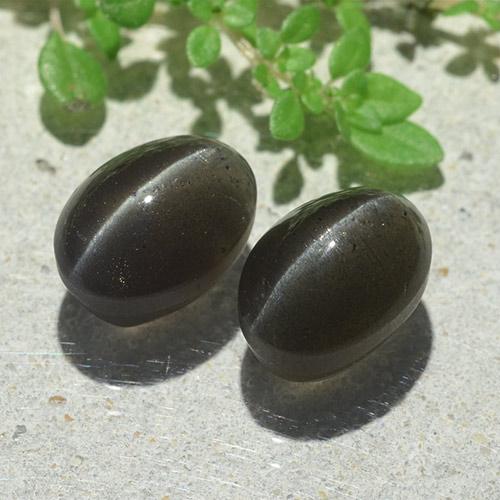 Натуральный чёрный cat's eye scapolite 6,12 карата огранка овал, полупрозрачный