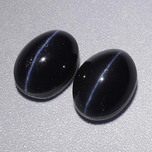 Натуральный чёрный cat's eye scapolite 4,46 карата огранка овал, непрозрачный