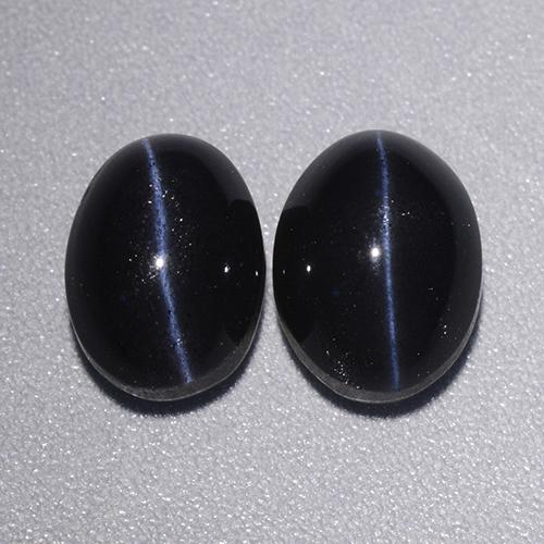 Натуральный чёрный cat's eye scapolite 4,46 карата огранка овал, непрозрачный