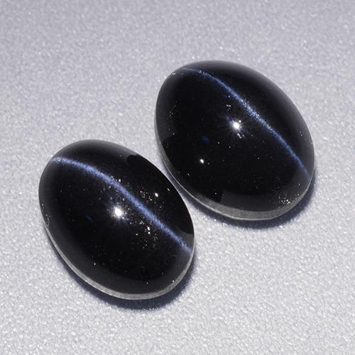 Натуральный чёрный cat's eye scapolite 4,46 карата огранка овал, непрозрачный