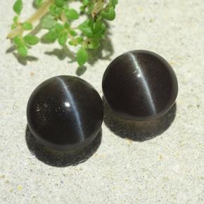 Натуральный коричневый cat's eye scapolite 4,77 карата огранка круг, полупрозрачный